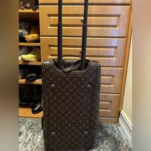 Almost new Louis Vuitton rolling duffle bag only used a few times.